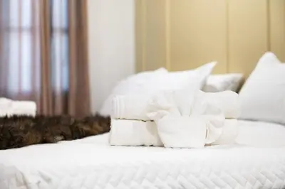 a pile of towels sitting on top of a bed at Pocono Summit Lodge Game Room & Family Fun in Pocono Summit