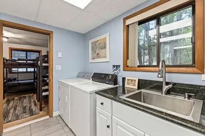 a kitchen with a sink and a counter top at Pocono's Resort | Fire Pit, Jacuzzi, Winter Sport in Lake Ariel
