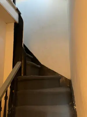 a set of stairs leading up to a building at Quite and Sweet guest room near nyc in Guttenberg