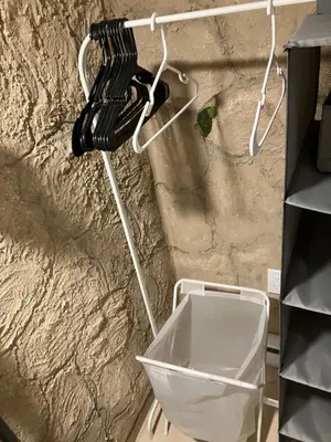 a black and white phone hanging on a wall at Comfort guest room near everything in Guttenberg