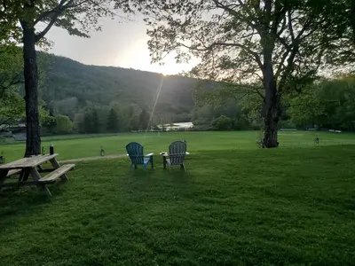 two chairs and a picnic table in a park at Sunset Over The Junction in Roscoe