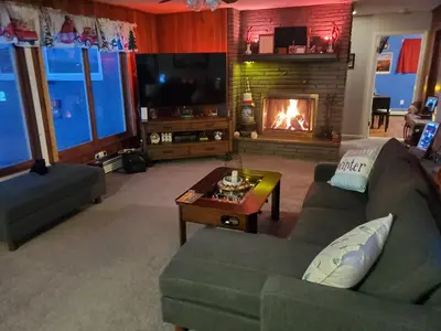 a living room with a couch and a fireplace at Sunset Over The Junction in Roscoe