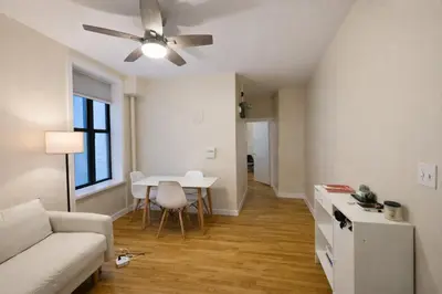 a living room with a couch and a table at Bright & Modern Apartment Near Subway & Columbia in New York