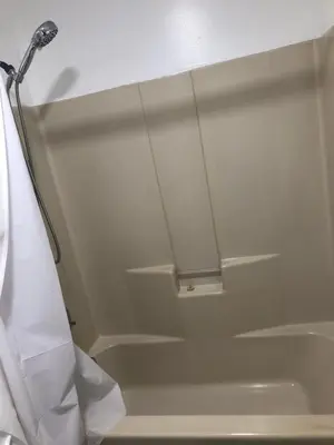 a shower in a bathroom with a shower curtain at Comfort house with two bed room in Greenwich