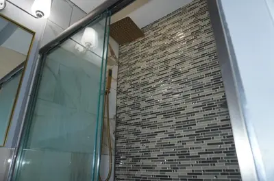 a brick wall with a glass door in a building at New York Private Room 32 in West New York