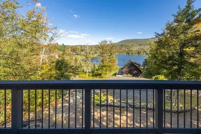a view of a lake from a balcony at Cozy Mountain Retreat 3 Min to Hunter Mountain in Hunter
