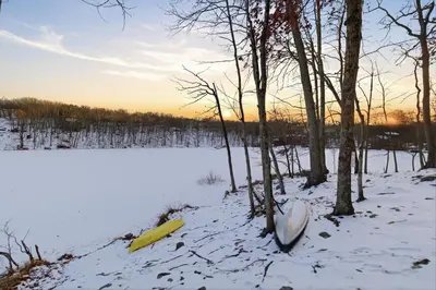 two frisbees in the snow next to a snow covered field at The Waters Edge Escape in East Stroudsburg