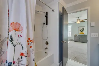 a bathroom with a shower with a shower curtain at Family Retreat with Game Room, 4 Mi to Kalahari! in Emerald Lakes