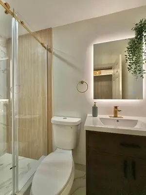 a bathroom with a toilet and a sink and a shower at Spring Rooms by Yale & Downtown in New Haven