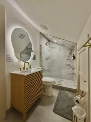 a bathroom with a toilet and a sink and a shower at Spring Rooms by Yale & Downtown in New Haven