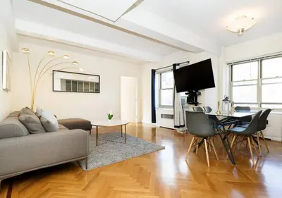a living room with a couch and a table at Time Square Vicinity- Luxury 2BR 2BA NYC Apt in New York