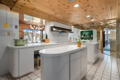 a kitchen with white counters and a wooden ceiling at 10K sqft Estate 2 Pools Pond Games Sauna Hot Tub in East Stroudsburg