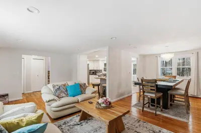 a living room with a couch and a table at Comfortable Bloomfield 3BR Retreat home in Bloomfield