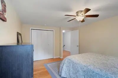 a bedroom with a ceiling fan and a bed at Comfortable Bloomfield 3BR Retreat home in Bloomfield