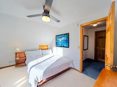 a bedroom with a bed and a ceiling fan at Private, Family-Friendly Home Near Candlewood Lake in New Fairfield