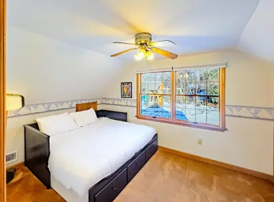 a bedroom with a bed and a ceiling fan at Private, Family-Friendly Home Near Candlewood Lake in New Fairfield