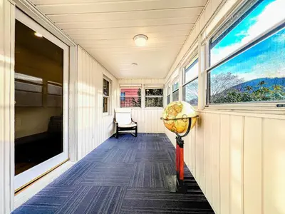 a hallway of a house with a window and a globe at Private, Family-Friendly Home Near Candlewood Lake in New Fairfield