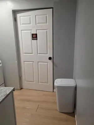 a white door with a no entry sign on it at A newly renovated room with private toilet & bathroom in a 3 bedroom apartment on the ground floor in Irvington