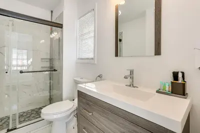 a bathroom with a sink and a toilet and a shower at Game Room and Hot Tub Family Gem on Lake Hopatcong