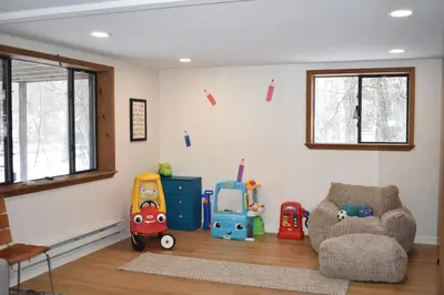 a childs room with toys on the floor at A-Frame Chalet Ski Lodge Near Shawnee in East Stroudsburg