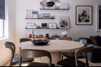 a living room with a table and chairs at Modern 2BR Brooklyn Retreat Near Manhattan with Private Backyard in Brooklyn