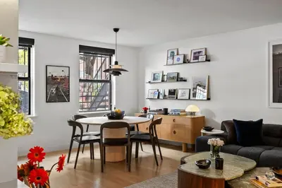 a living room with a table and a couch at Modern 2BR Brooklyn Retreat Near Manhattan with Private Backyard in Brooklyn