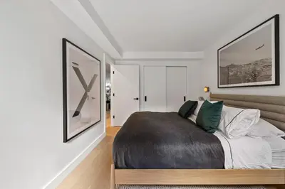 a bedroom with a large bed in a room at Modern 2BR Brooklyn Retreat Near Manhattan with Private Backyard in Brooklyn