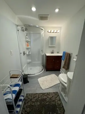 a bathroom with a shower and a toilet and a sink at 3-bedroom peaceful apartment close to Fairfield University in Fairfield