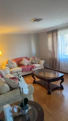 a living room with a couch and a coffee table at Stratford Getaway in Stratford
