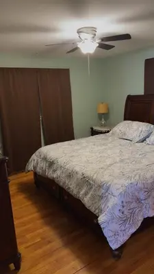 a bedroom with a bed and a ceiling fan at Stratford Getaway in Stratford