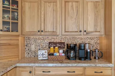 a kitchen counter with a coffee maker on a counter top at Entire Chalet in Windham NY in Maplecrest