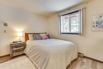 a small bedroom with a bed and a window at 3 Mi to Windham Mountain Pet-Friendly Apt with Yard in Hensonville
