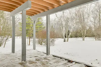 a screened in porch with snow on the ground at 3 Mi to Windham Mountain Pet-Friendly Apt with Yard in Hensonville