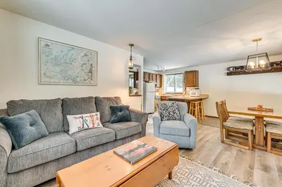 a living room with a couch and a table at 3 Mi to Windham Mountain Pet-Friendly Apt with Yard in Hensonville