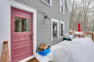 a pink door on a house with snow next to it at 2 Mi to Belleayre Mtn! Extended Base in Pine Hill in Pine Hill