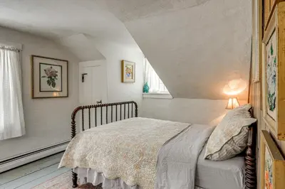 a bedroom with a bed and a window at Historic 1820s Homestead on Battenkill River! in Arlington