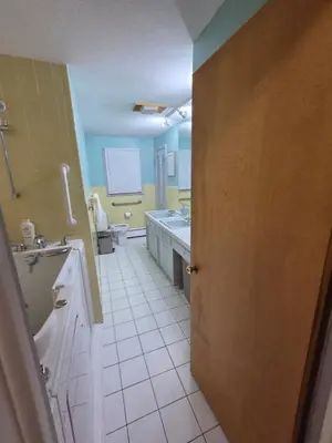 a bathroom with a toilet and a sink at cozy 5bd single -family home in Longmeadow in Longmeadow
