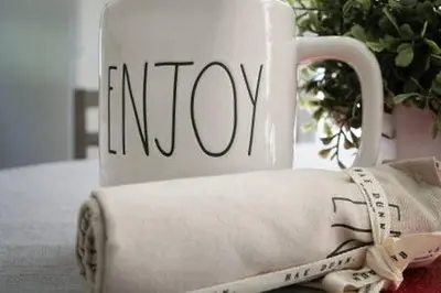 a roll of napkin and a coffee mug on a table at Eden's Cozy Oasis in Windsor