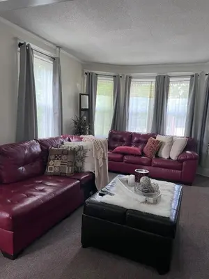 a living room with two couches and a coffee table at Eden's Cozy Oasis in Windsor