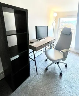 an office with a desk with a computer and a chair at Cozy 3BR Home - Hudson Valley views near Woodbury Commons in Highland Mills