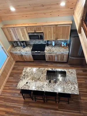 an overhead view of a kitchen in a tiny house at Cattail Cabin in Waterville