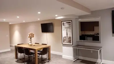 a dining room with a table and chairs at Rose Hotel Near Yankee Stadium in Bronx