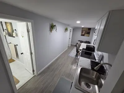 a kitchen with a sink and a counter top at Private Executive Suite in Waterbury
