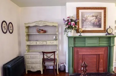 a living room with a green fireplace and a painting at 20 min Woodbury Outlet & USMA 35 min Mt Creek in Chester
