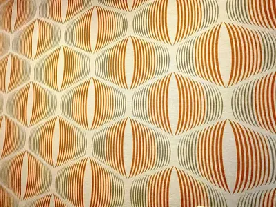 an orange and white pattern on the side of a pillow at Bright 2-Story Brooklyn Oasis w Patio & Fire Pit in Brooklyn