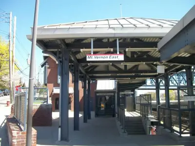 a train station with a sign that reads will terminal east at Superior Queen Bed & Fulton Bed in Mount Vernon
