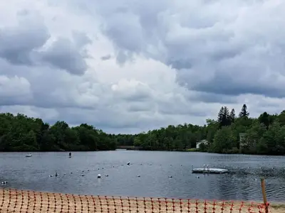 a lake with a bunch of boats in the water at Charming Family Friendly House, Hot tub, Playroom in Long Pond