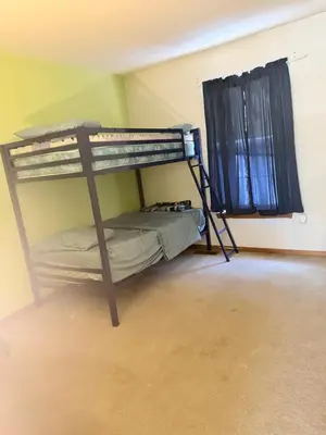 a bedroom with two bunk beds in a room at Poconos home away from home in East Stroudsburg