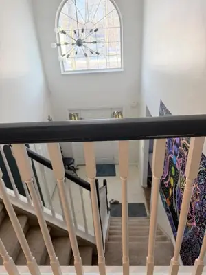 a stairway with a window and a stair railing at Poconos home away from home in East Stroudsburg
