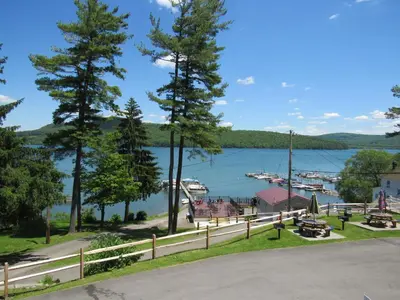 a view of a marina with boats in the water at Lake 'N Pines Motel in Cooperstown